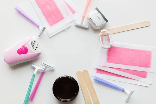 Hair removal wax, epilator and safety razor — Stock Photo, Image