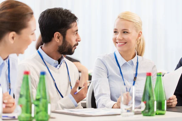 Happy business team at international conference — Stock Photo, Image
