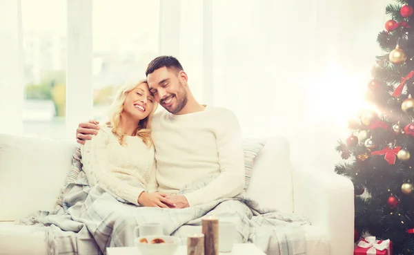 Happy couple at home with christmas tree — Stock Photo, Image