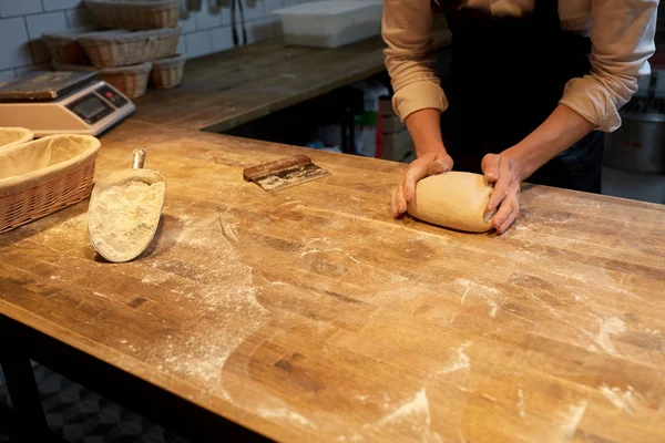 Baker making bread dough at bakery kitchen — Stock Photo, Image