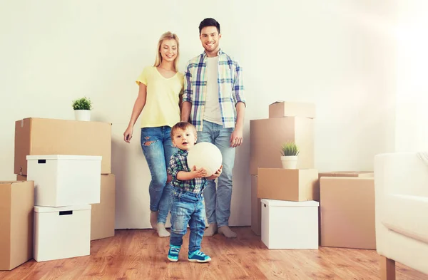 Happy family moving to new home and playing ball Stock Image