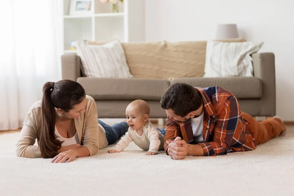 Happy family playing with baby at home — Stock Photo, Image