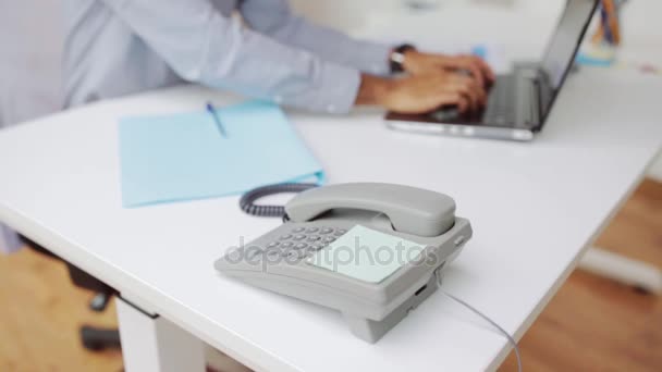 Businessman hand dialing phone number at office — Stock Video