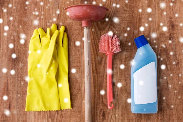 Plunger with toilet cleaning stuff on wood — Stock Photo, Image