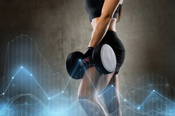 Woman with dumbbell in gym — Stock Photo, Image