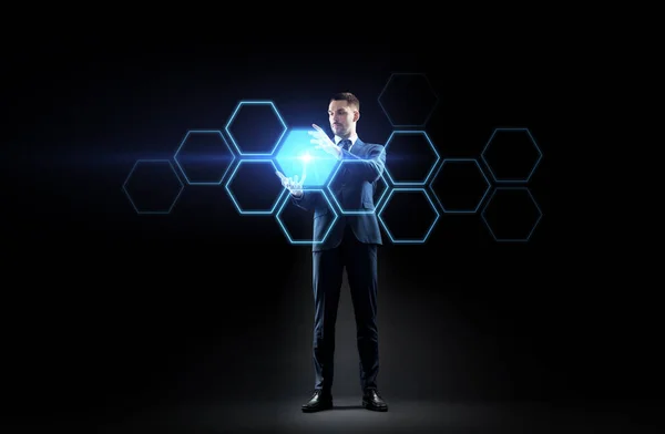 Businessman working with virtual network hologram — Stock Photo, Image