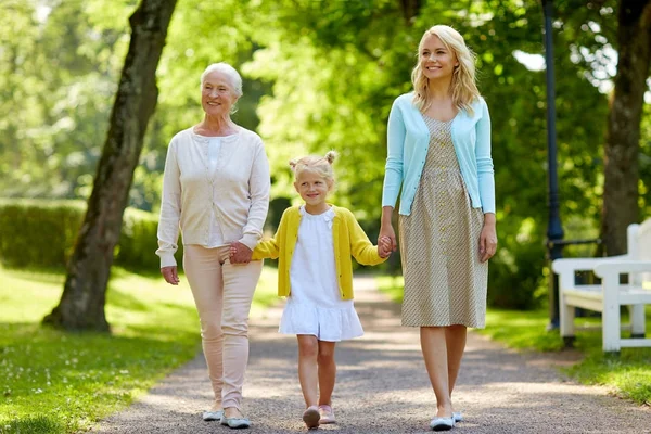 Happy mother, daughter and grandmother at park — Stock Photo, Image