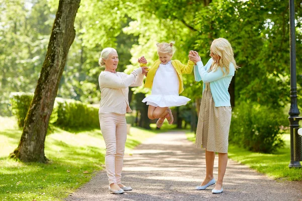 Happy mother, daughter and grandmother at park — Stock Photo, Image