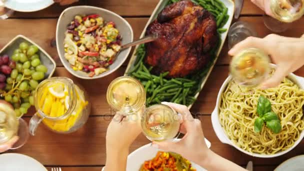 Group of people eating and drinking wine at table — Stock Video