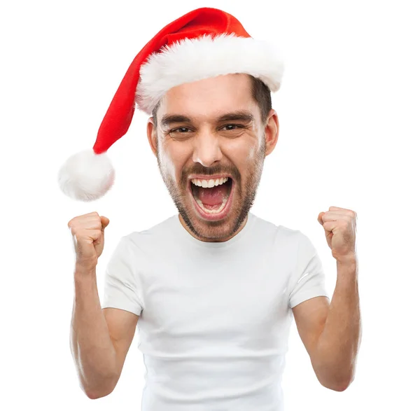 Urlando uomo in cappello di Babbo Natale celebrando la vittoria — Foto Stock