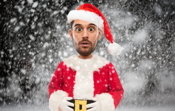 Homem em santa claus traje sobre Natal neve Fotografias De Stock Royalty-Free