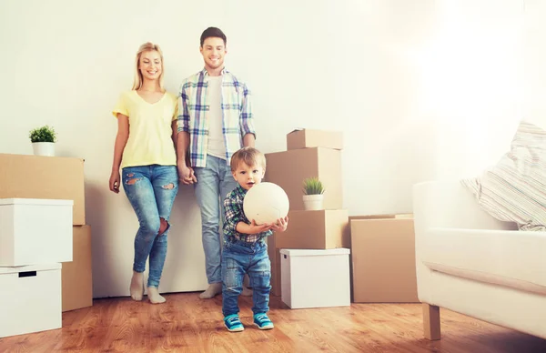 Happy family moving to new home and playing ball Stock Photo