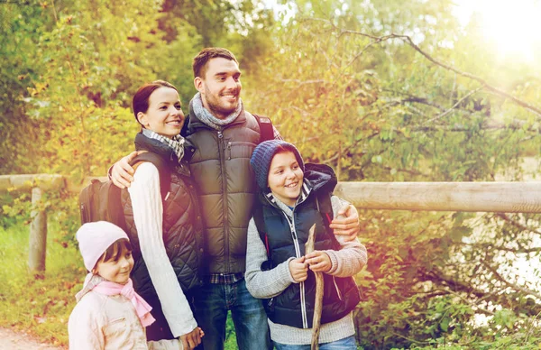 Happy family with backpacks hiking — Stock Photo, Image