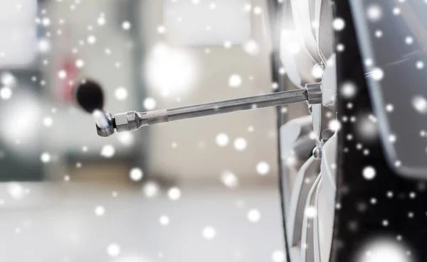 Screwdriver and car wheel tire — Stock Photo, Image