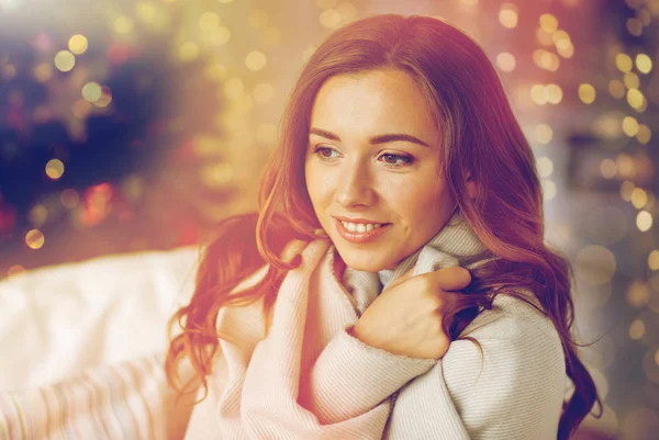 Happy young woman with plaid at home for christmas — Stock Photo, Image