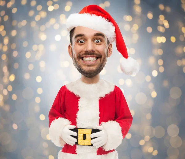 Uomo in costume da Babbo Natale sopra le luci di Natale — Foto Stock