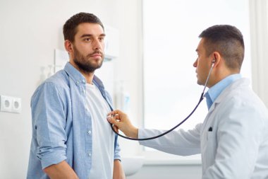 doctor with stethoscope and patient at hospital clipart