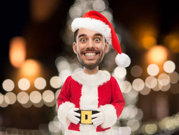 Uomo in costume da Babbo Natale sopra le luci di Natale — Foto Stock