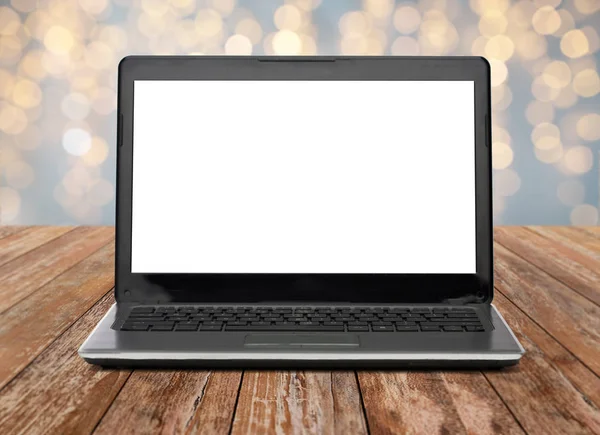 Laptop computer with white screen over lights — Stock Photo, Image