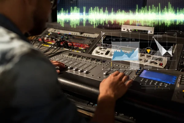 Sound engineer at recording studio mixing console — Stock Photo, Image