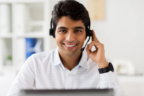 Businessman with headset and computer at office — Stock Photo, Image