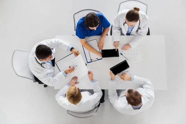 Doctors with cardiograms and tablet pc at hospital — Stock Photo, Image