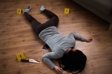 dead woman body lying on floor at crime scene clipart