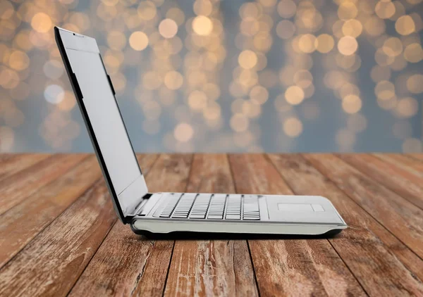 Laptop computer over lights — Stock Photo, Image