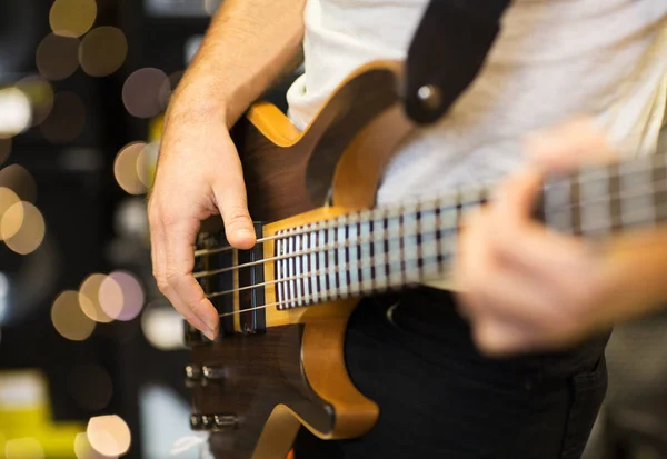 Close up of musician with guitar at music studio — Stock Photo, Image