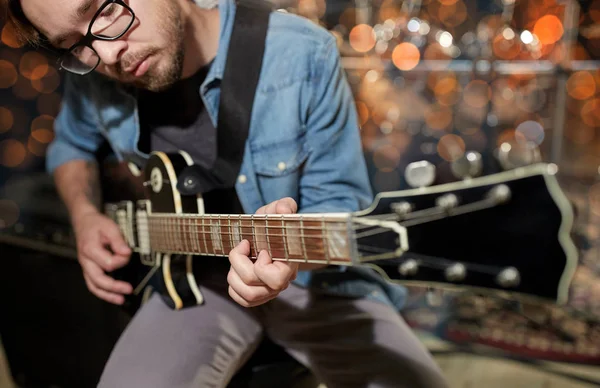 Musician playing guitar at studio or music concert — Stock Photo, Image