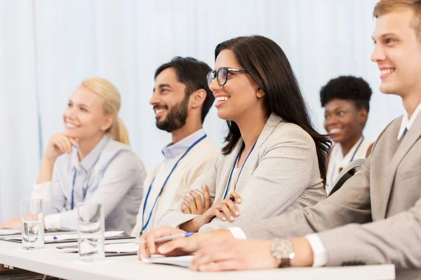 Happy business team at international conference — Stock Photo, Image