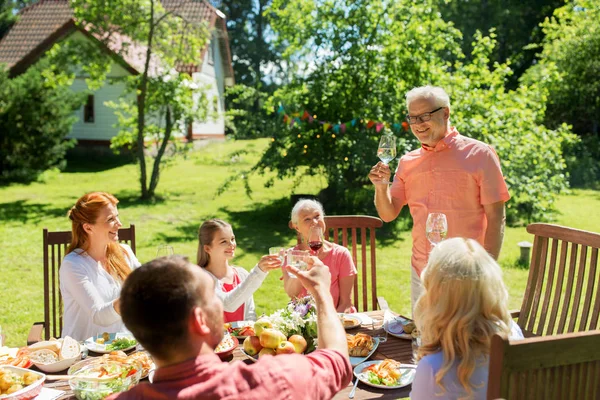 Family gathering at summer garden and celebration — Stock Photo, Image