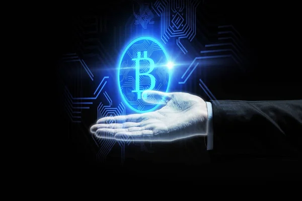 Close up of businessman hand with bitcoin symbol — Stock Photo, Image