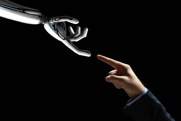 Robot y mano humana conectando los dedos — Foto de Stock