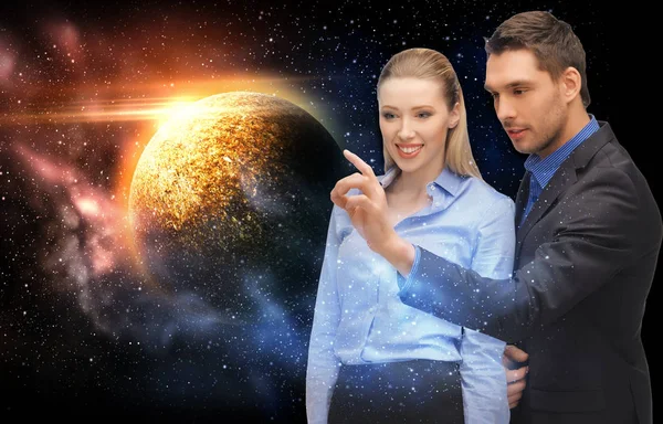 Business man and businesswoman over space — стоковое фото