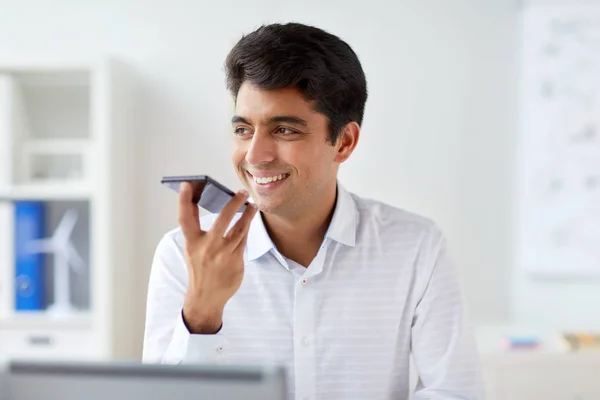 Businessman using voice recorder on smartphone — Stock Photo, Image