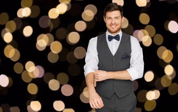 Happy man in festive suit dressing for party — Stock Photo, Image