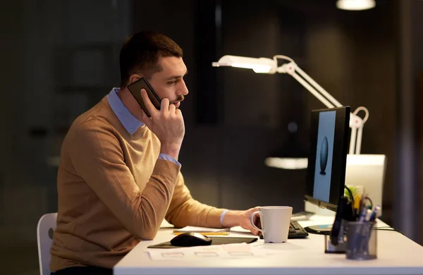 Man with smartphone working late at night office — Stock Photo, Image