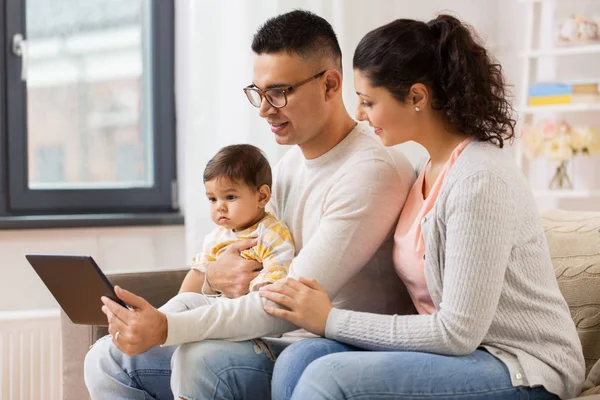 Mother, father and baby with tablet pc at home — Stock Photo, Image