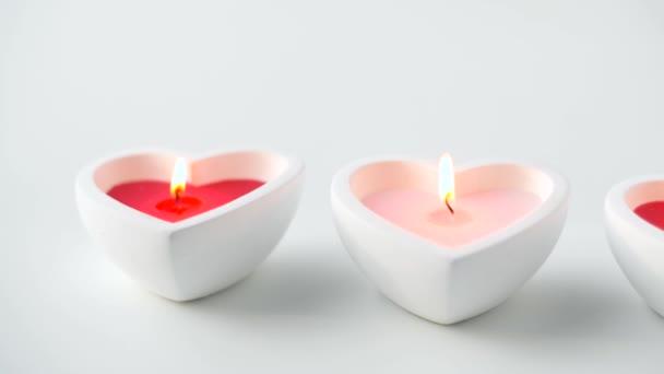 Heart shaped candles burning in st valentines day — Stock Video