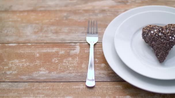 Close up of heart shaped decoration on plate — Stock Video