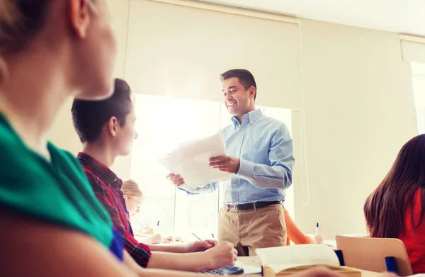 Group of students and teacher with test results — Stock Photo, Image