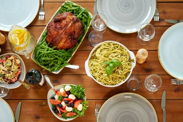 Various food on served wooden table — Stock Photo, Image