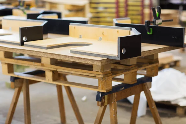 Furniture items on workbench at workshop — Stock Photo, Image