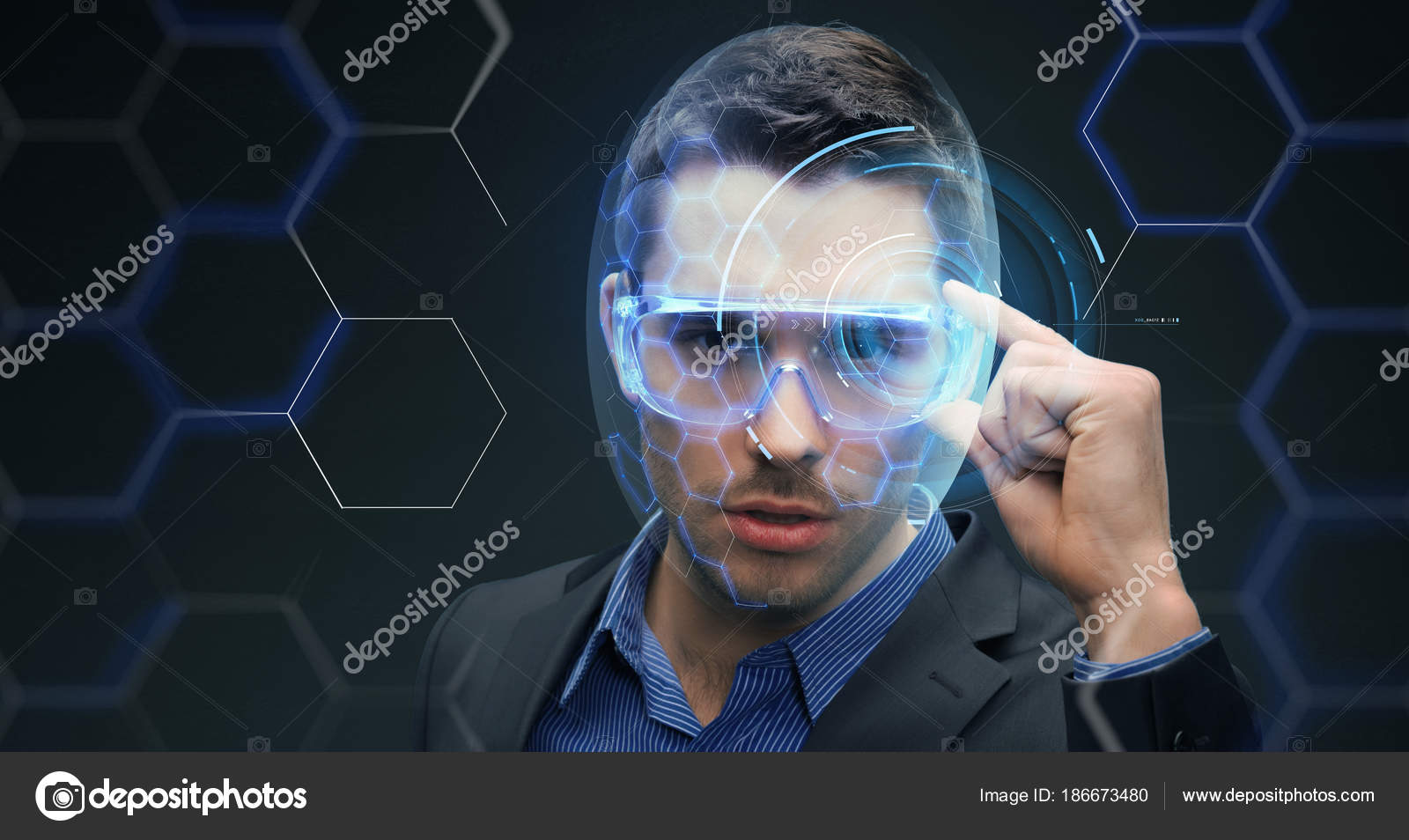 Businessman in 3d glasses with virtual hologram Stock Photo by ©Syda