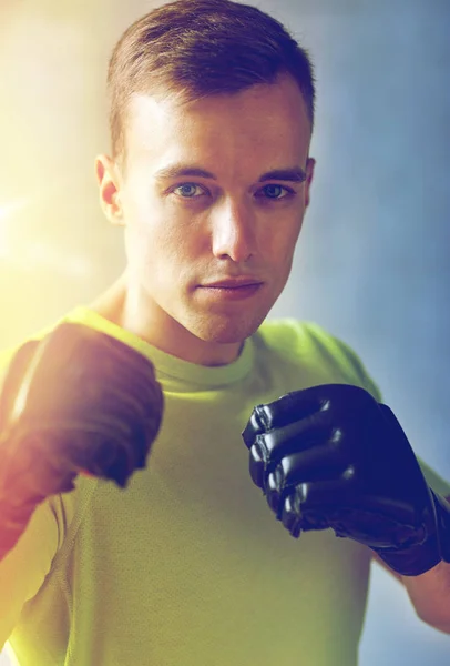 Young man in boxing gloves — Stock Photo, Image