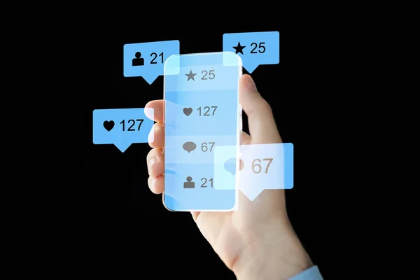 Hand with social media icons on smartphone — Stock Photo, Image