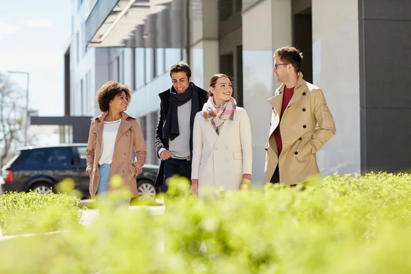 Office workers or friends talking on city street — Stock Photo, Image