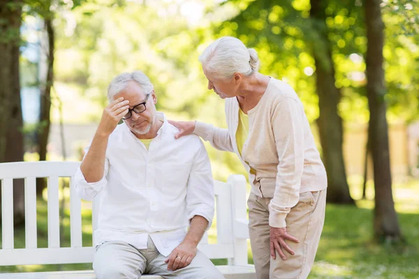 Senior man suffering from headache outdoors — Stock Photo, Image