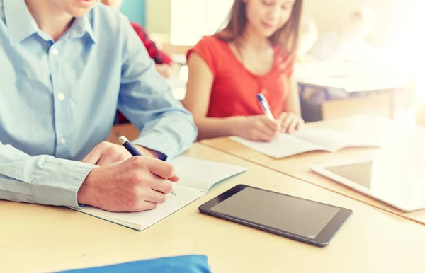 Close up of students tablet pc writing at school — Stock Photo, Image